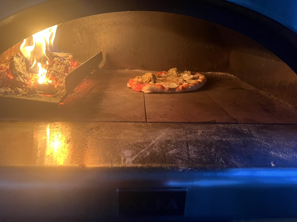 Pizza in a wood-fired oven